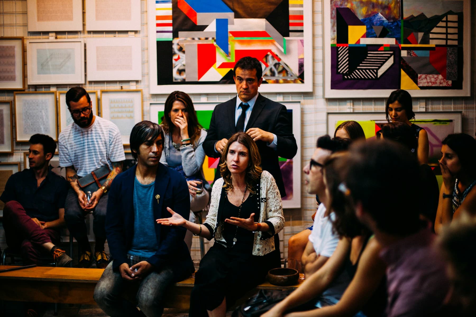 People gathered in a facilitated community discussion.